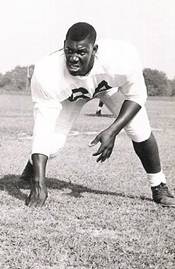 Clarence Clemons poses on the field as a member of the Maryland State football team.