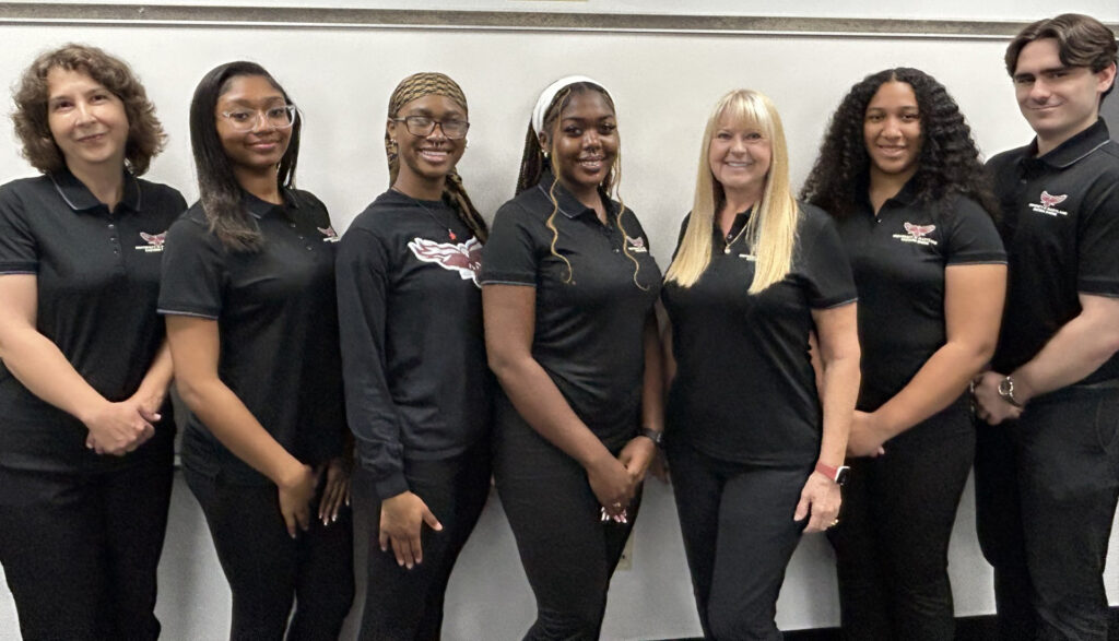 Writing Center Staff
2025-2026 Tutoring Team left to right: Dr. Gabriela Vlahovici-Jones, Professional Tutor; Aris Henry, Criminal Justice/ Pre-Law; J’nae Alvarado, Urban Forestry; Pearl Nyambi, English Education; Dr. Terry Kundell, Director; Stella Hanscom, Art Education; Zach Solembrino, Assistant Director. Photo by Ken Kundell.