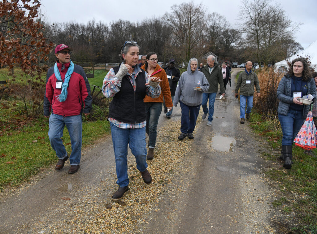 Agritourism Conference attendees take a tour of a farm.