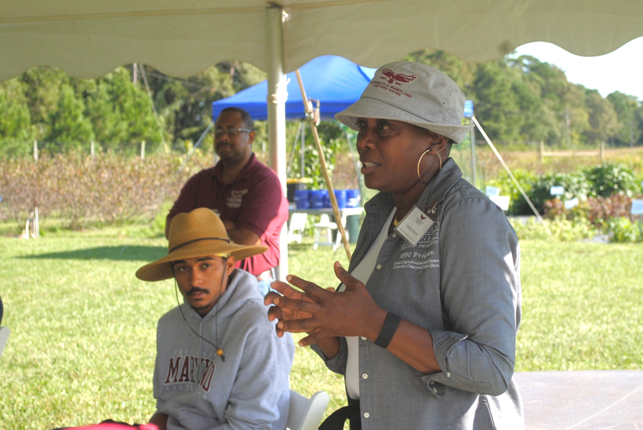Dr. Nadine Burton talks to participants at a Aronia Berry Picking Contest at UMES farm.