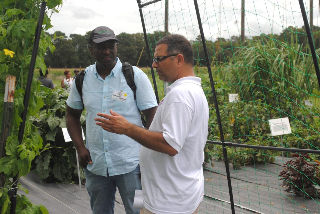 Dr. Naveen Kumar Dixit talks to an attendee at UMES Extension Ag Showcase.