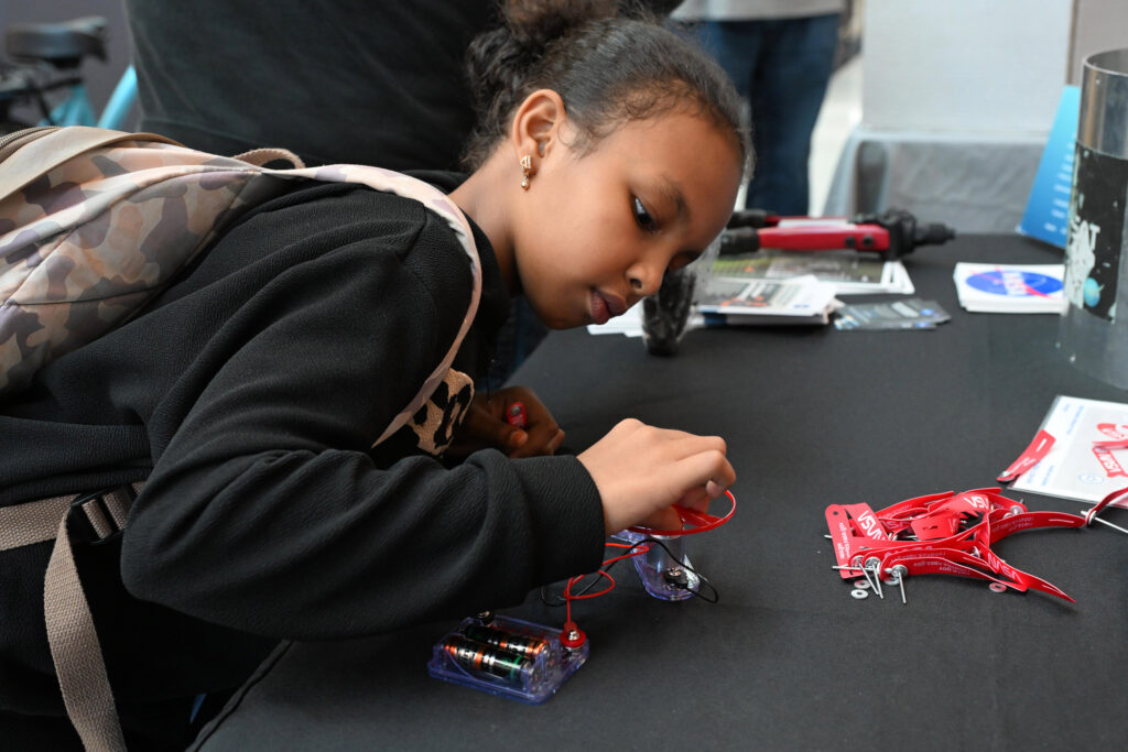 Malk Ali, 9, of Princess Anne completes a circuit during the UMES Extension 4-H Stem Festival 2024.