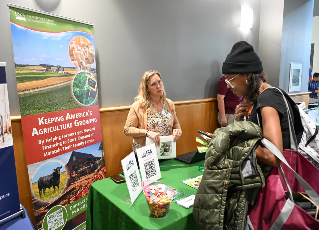 Attendees check out the vendors at 21st Small Farm Conference.