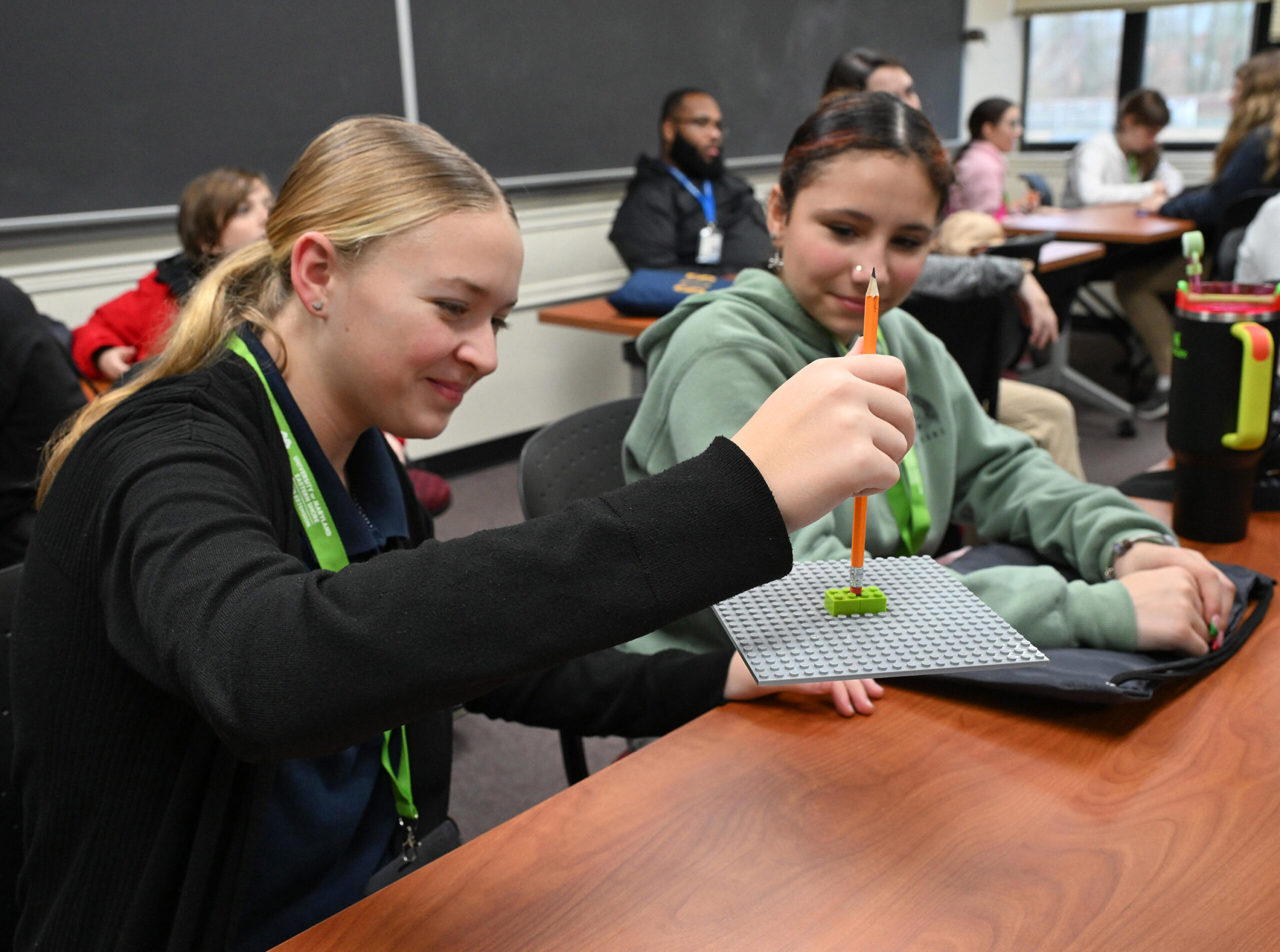 Somerset Intermediate School students Ella Beauchamp and Elizabeth Waters conduct a LEGO experiment during their visit to the University of Maryland Eastern Shore hosted by UMES Extension 4-H.
