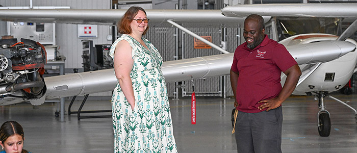 UMES Extension's Ariel Clay leads Horizons Delmarva summer campers on a tour of Salisbury Airport during science program.