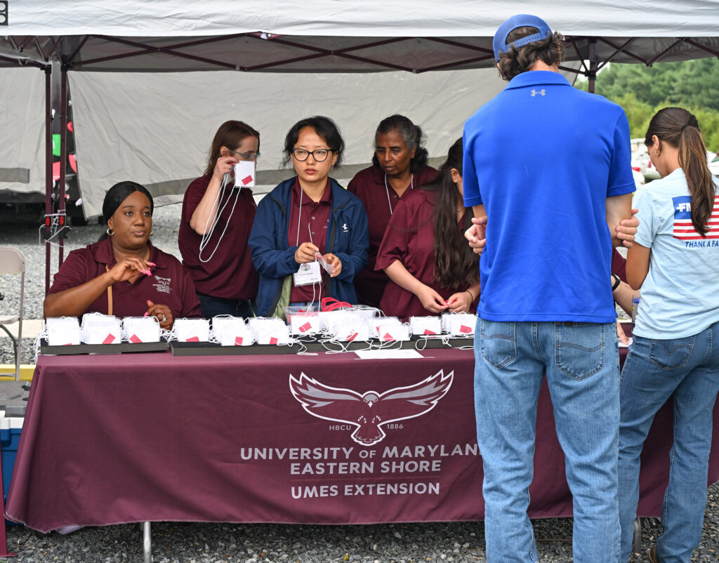 Volunteers man the check in table at 2025 Ag Showcase.