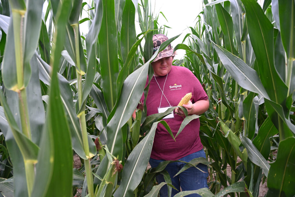 2025 Ag Showcase attendee checks out corn grown at the UMES test plot.
