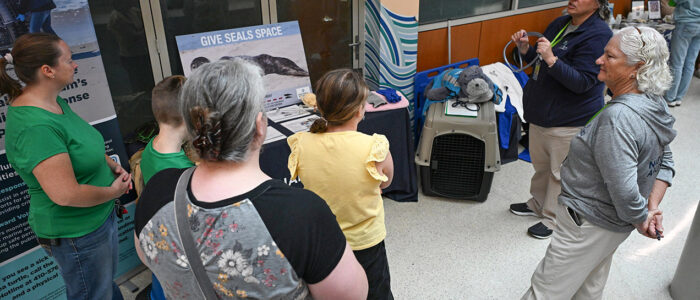 National Aquarium volunteer Tina Kahl, left, talks about what they do to rescue seals and about their new location in Ocean City during the 2025 UMES 4-H STEM Expo.
