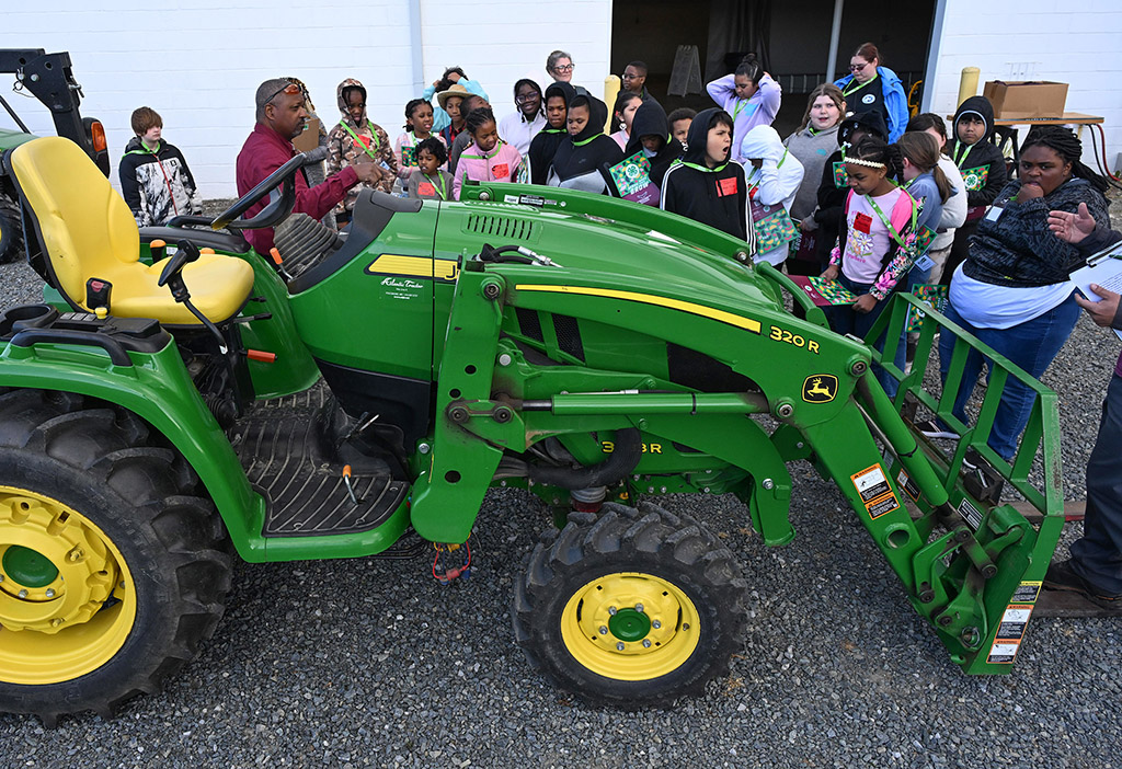 Students learn about farm equipment from UMES Extension's Henry Jackson.