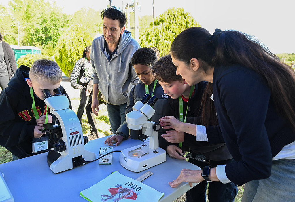 Somerset County students look through microscopes during third AgVenture Program at UMES farm.