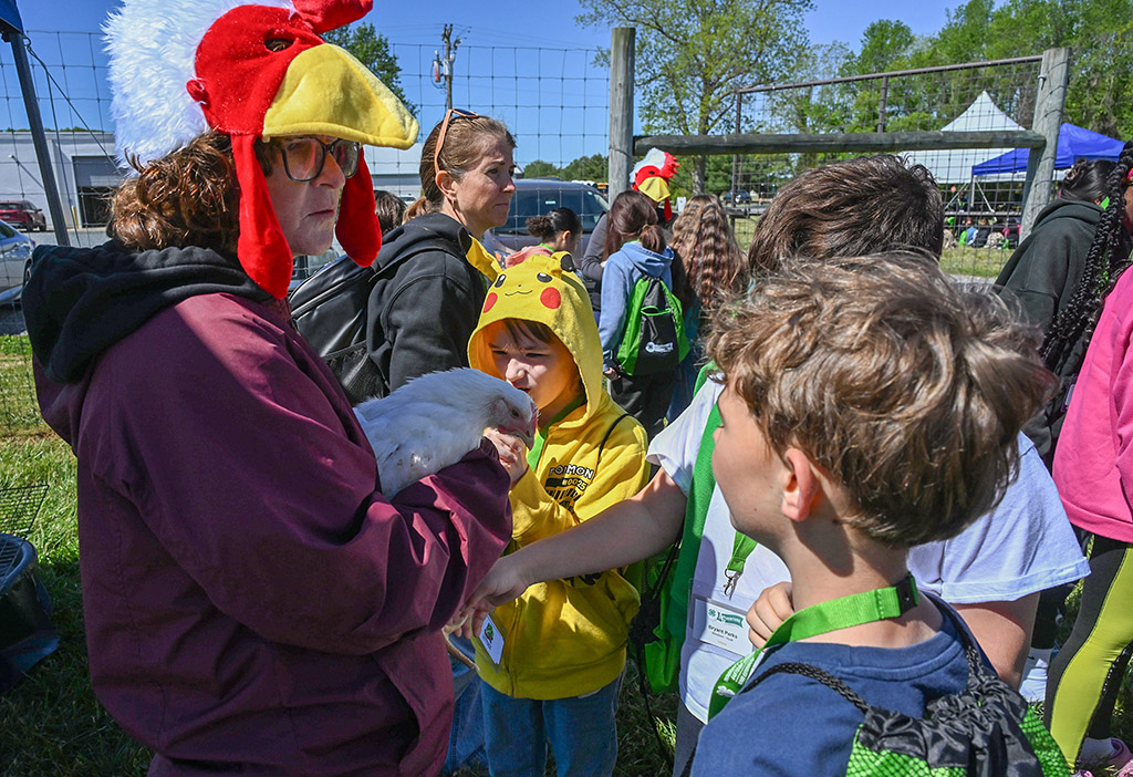 Dr. Jennifer Timmons holds a chicken as Somerset County students learn more about the birds.