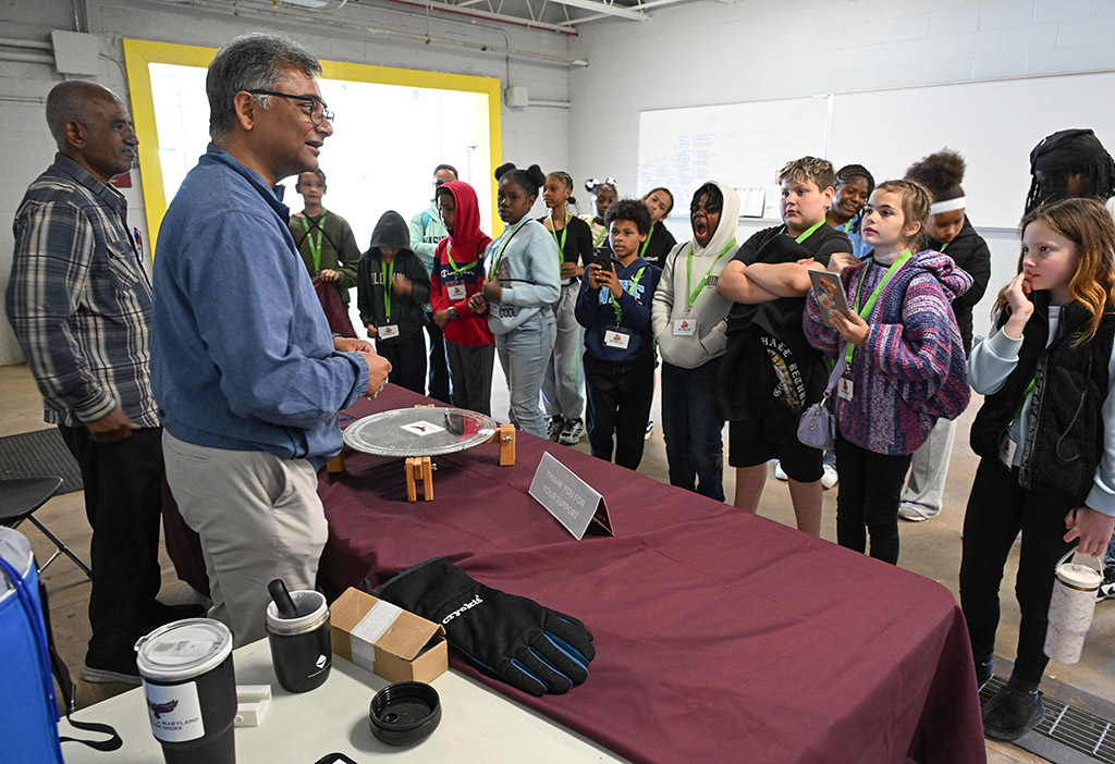Dr. Kausiksankar Das conducts an experiment for Somerset County students.