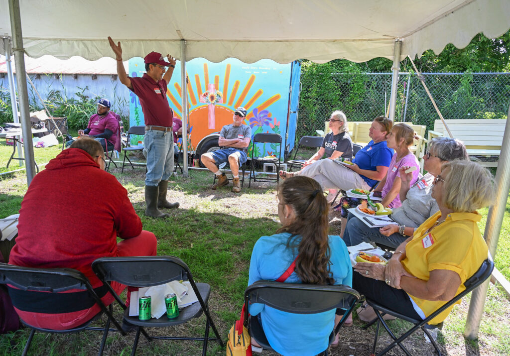 Dr. Lila Karki speaks at a field demonstration.
