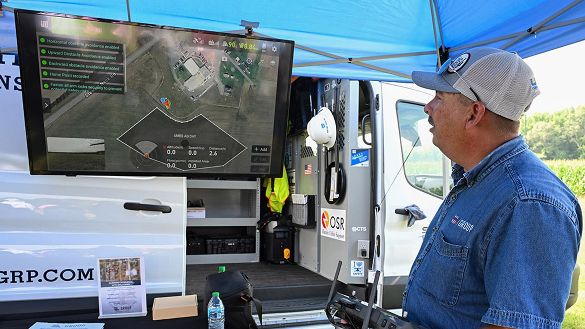 TGD-agshowcase-1538 Sentinel Robotics representative explains drone technology at Ag Showcase.