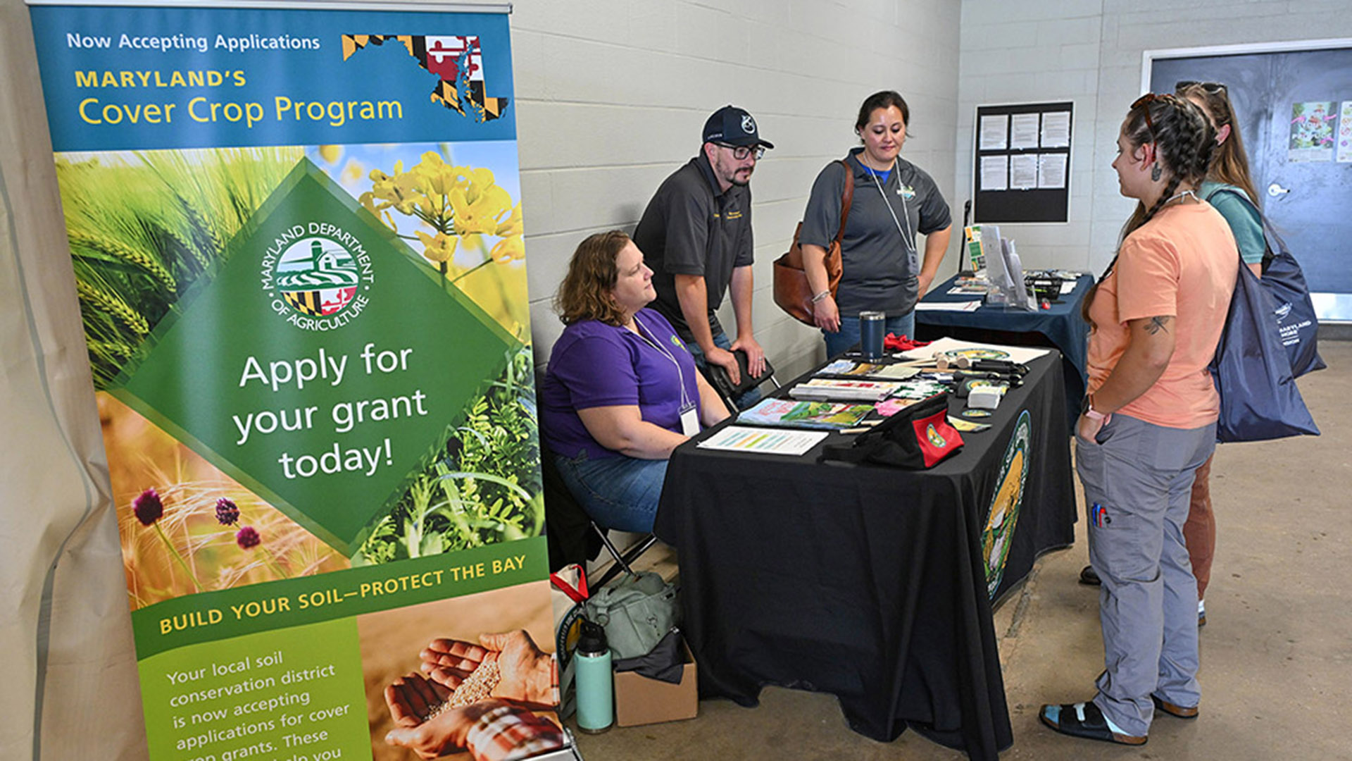 TGD-agshowcase-1771 Ag Showcase attendees check out one of the exhibitor table.