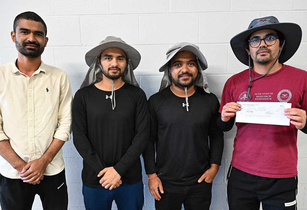 Members of Team One, first place winners of the 6th annual Aronia Berry Contest, pose with their check.