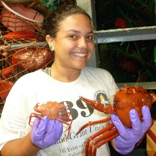 Stephanie Martinez-Rivera holds a crab