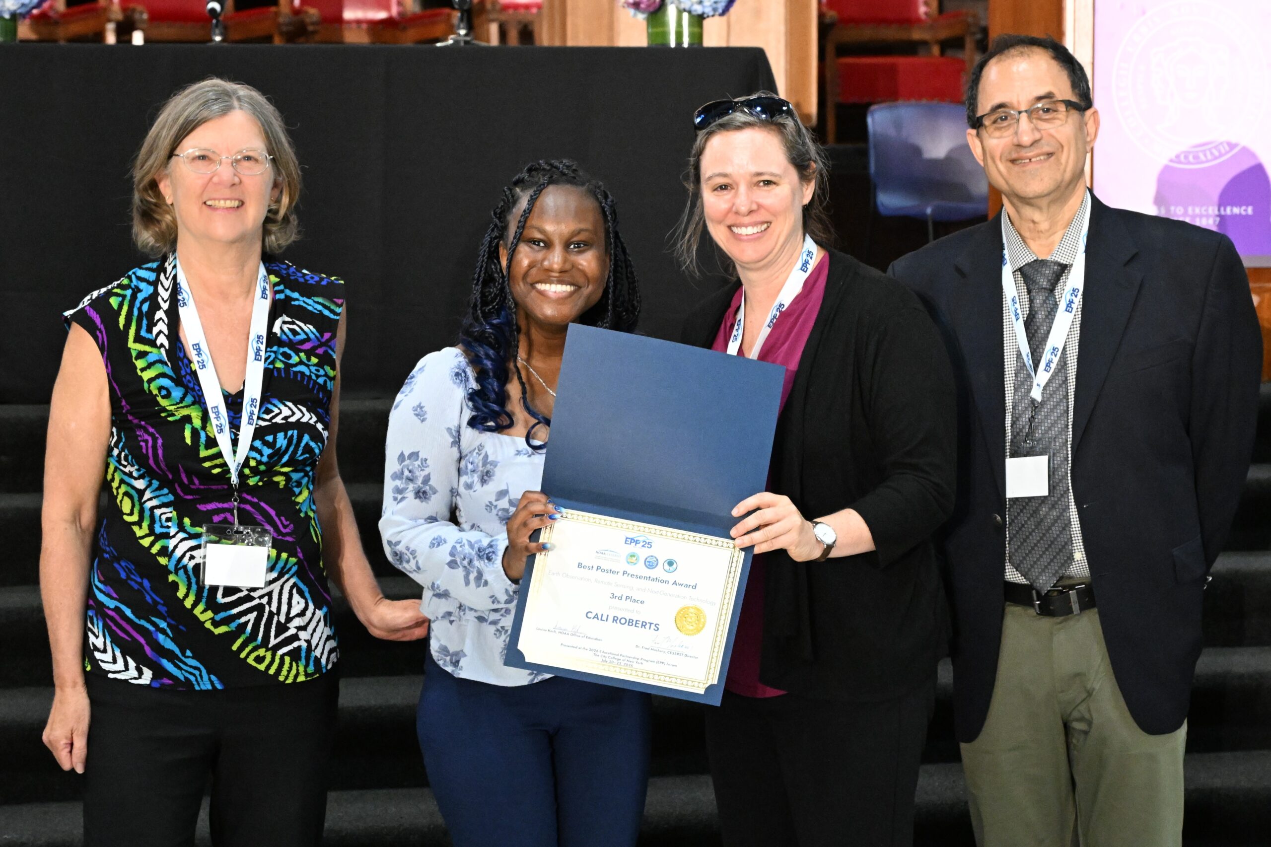 NOAA LMRCSC Fellow Cali Roberts (second from left) wins an award for her research poster presentation.