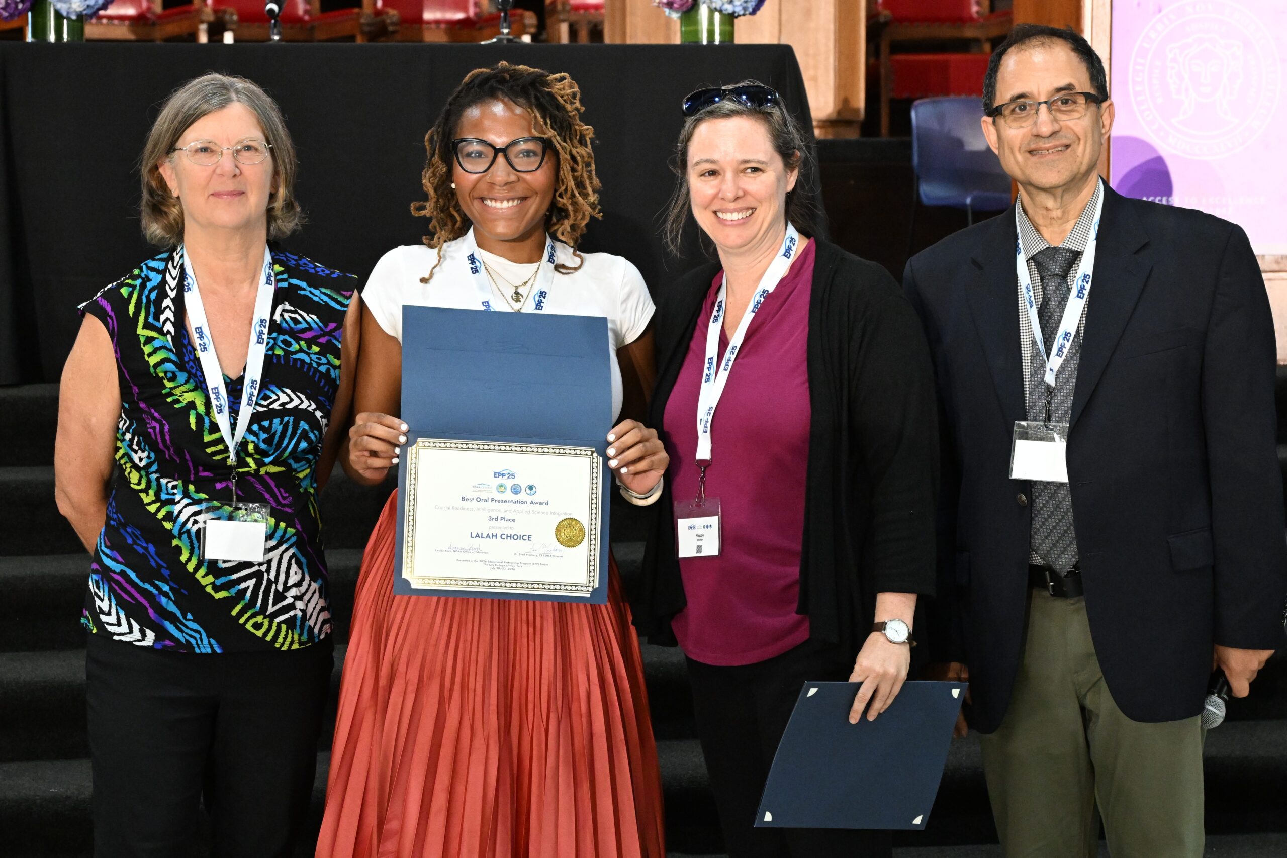 NOAA LMRCSC Fellow Lalah Choice (second from left) wins an award for her oral research presentation.