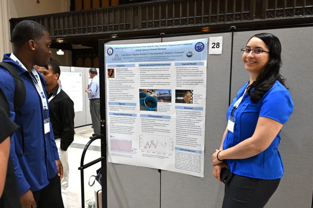 NOAA LMRCSC fellow Litzia Galvan (right) shares her research poster at the 2026 NOAA EPP Biennial Education & Science Forum.