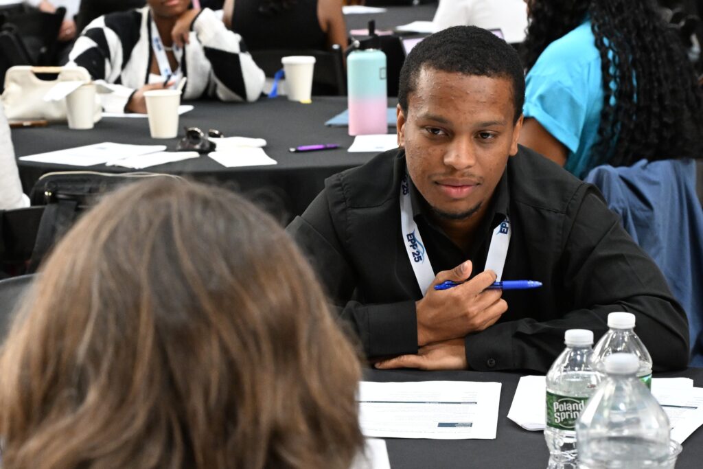 LMRCSC Fellow Aaron Pickett role plays a job interview during a workshop at the 2026 NOAA EPP forum.