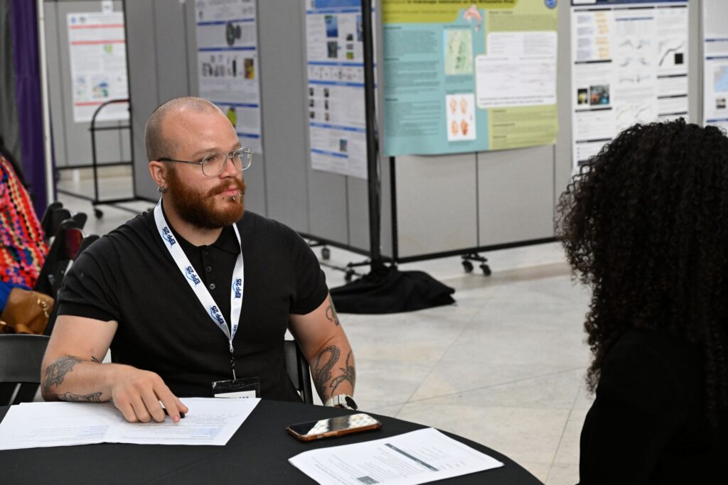 LMRCSC Fellow Brede Gibson role plays a job interview during a workshop at the 2026 NOAA EPP forum.