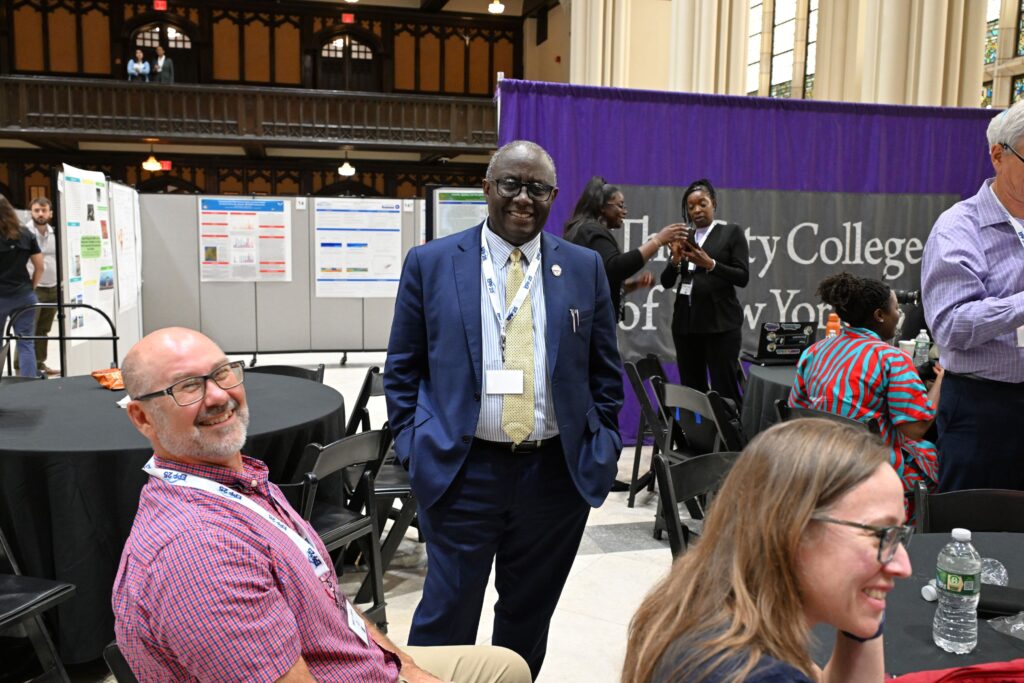 UMES School of Agricultural and Natural Sciences Dean Dr. Moses Kairo (center) chats with faculty at the 2026 NOAA EPP Education & Science Forum. 