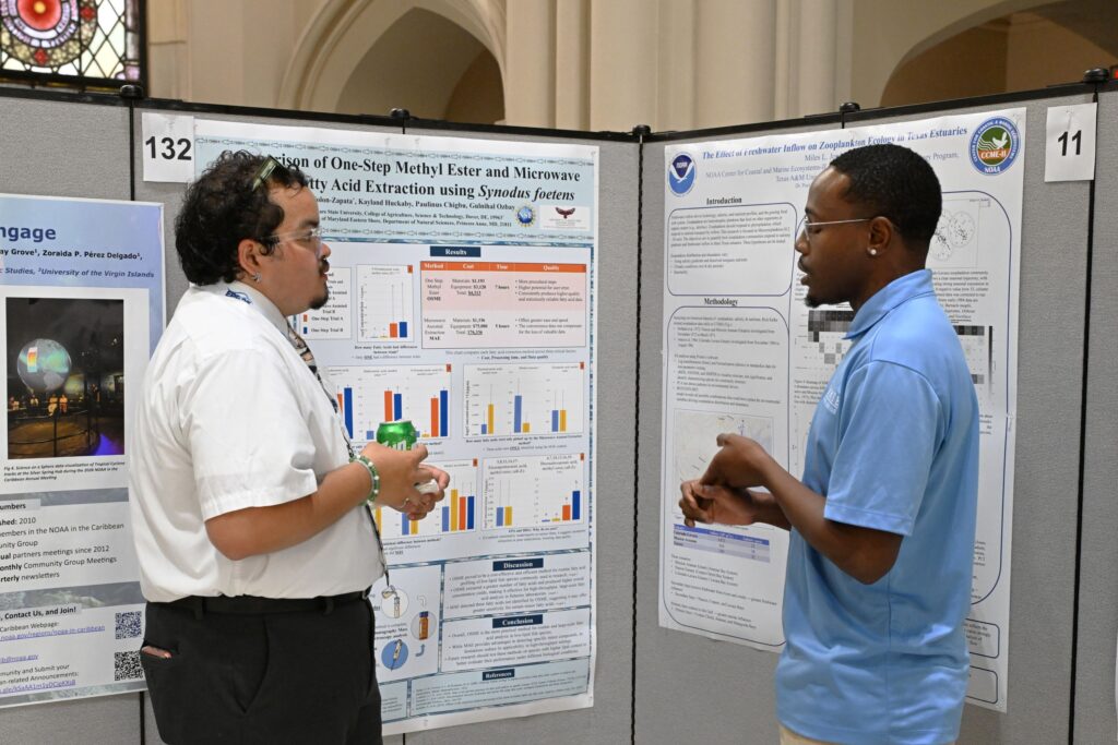 LMRCSC Fellow Angel Colon-Zapata  (left) discusses research with a CCME fellow at the 2026 NOAA EPP forum.