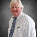 Dr. Eric B. May