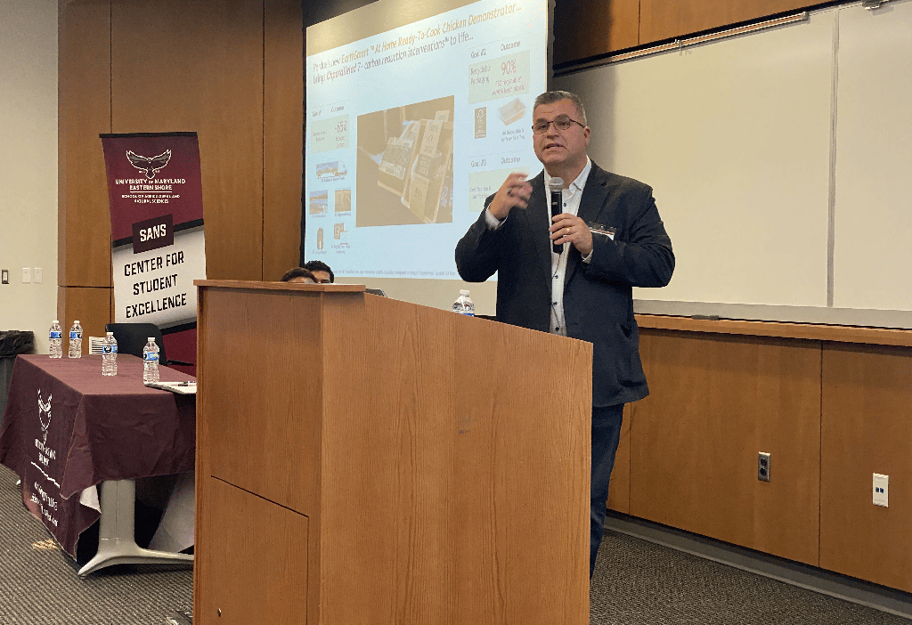 A speaker from Perdue Farms talks about research at the Center for Student Excellence's second Student-led Undergraduate Research Symposium in December 2025.