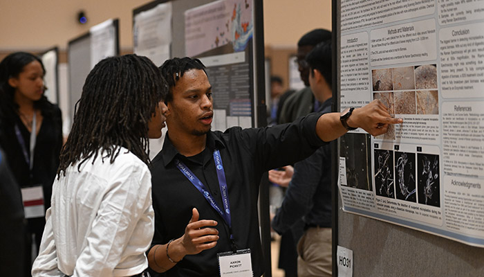 Delaware State University student and NOAA LMRCSC Fellow Aaron Pickett presents his research poster at the 11th biennial NOAA Educational Partnership Program Education and Science Forum. Photo by FotoJoe Photography.