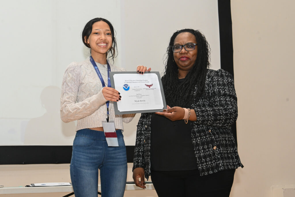 UMES undergraduate and NOAA LMRCSC Fellow Myah Bowie receives an award for her research presentation. Photo by Kara Nuzback.