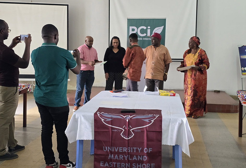 University of Maryland Eastern Shore professors Simon Zebelo and Salina Parveen presents awards after a training session at Kinshasa Plant Clinic.