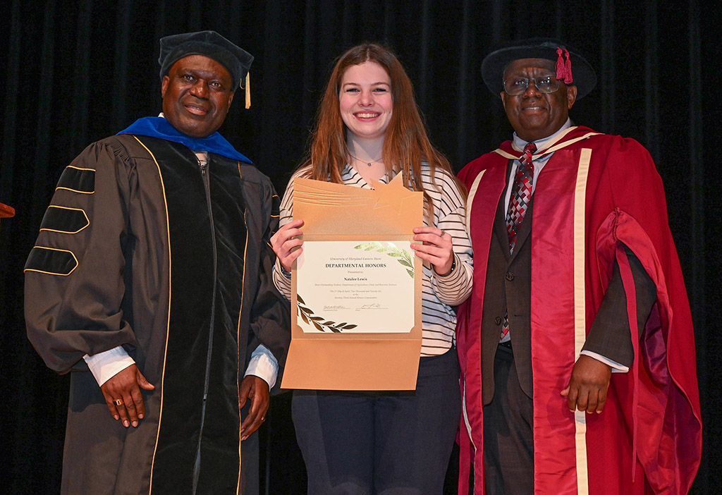 Department of Agriculture, Food and Resource Sciences winner Natalee Lewis with chair Dr. Stephan Tubene, left, and Dean Dr. Moses T. Kairo at the 73rd Honors Convocation.