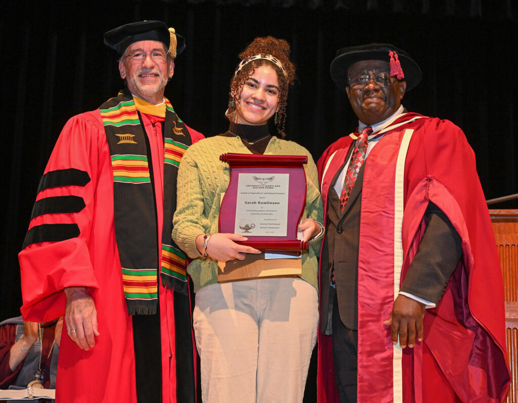 Department of Natural Sciences winner Sarah Rawlinson with chair Dr. Jonathan Cumming, left, and Dean Dr. Moses T. Kairo.