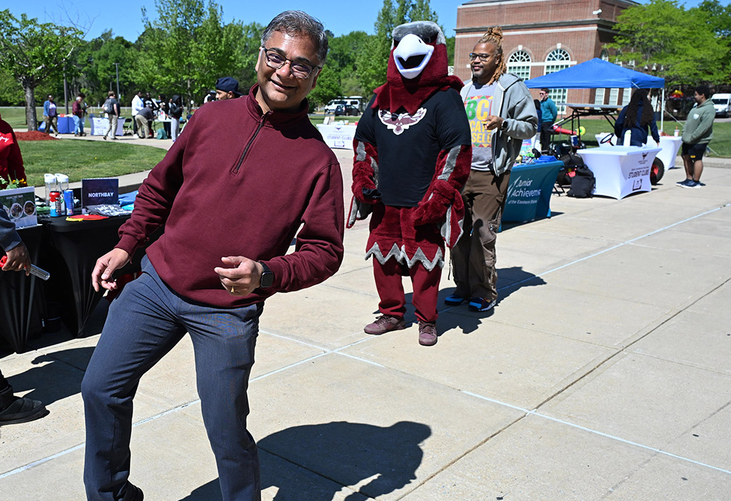 Center for Student Excellence Director Dr. Kausiksankar Das dances with Harry the Hawk at the 2026 DASL Expo.