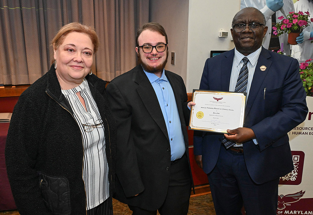 Award winner Ezra Cable with Dean Dr. Moses T. Kairo and Dr. Victoria Volkis at the SANS end of the year awards.