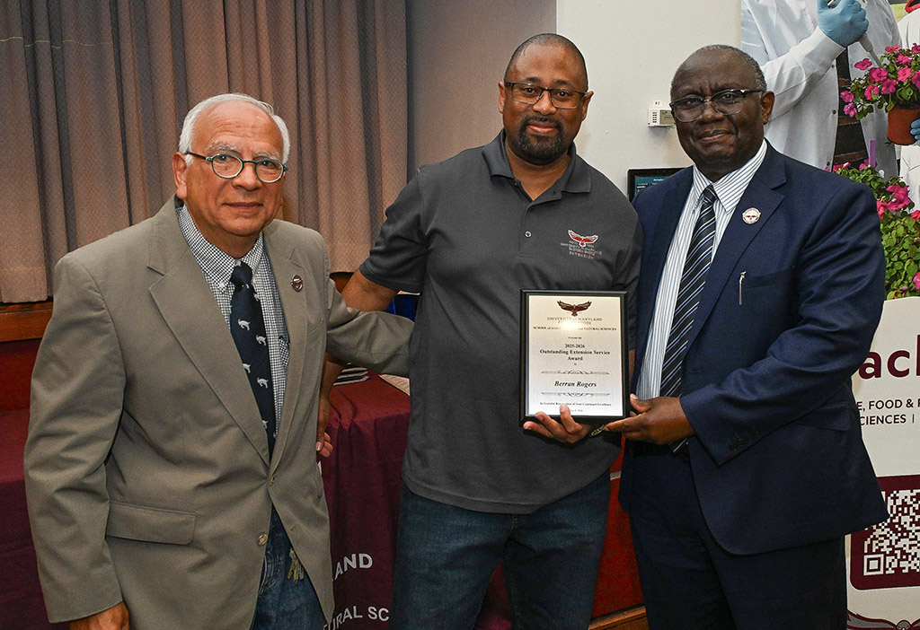 Outstanding Extension Service Award winner Berran Rogers with Dean Dr. Moses T. Kairo and Associate Dean Dr. E.N. Escobar.