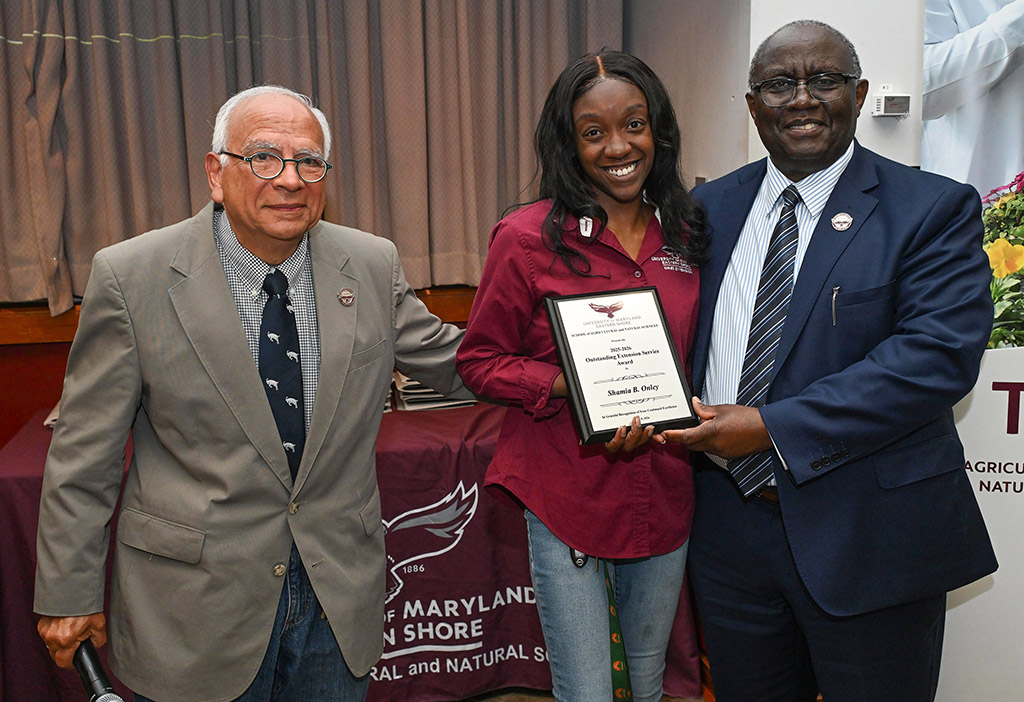 Outstanding Extension Service Award winner Shamia B. Onley with Dean Dr. Moses T. Kairo and Associate Dean Dr. E.N. Escobar.
