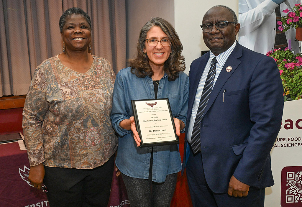 Human Ecology Outstanding Teaching Award winner Dr. Donna Long with Dean Dr. Moses T. Kairo and Chair Dr. Grace Namwamba.