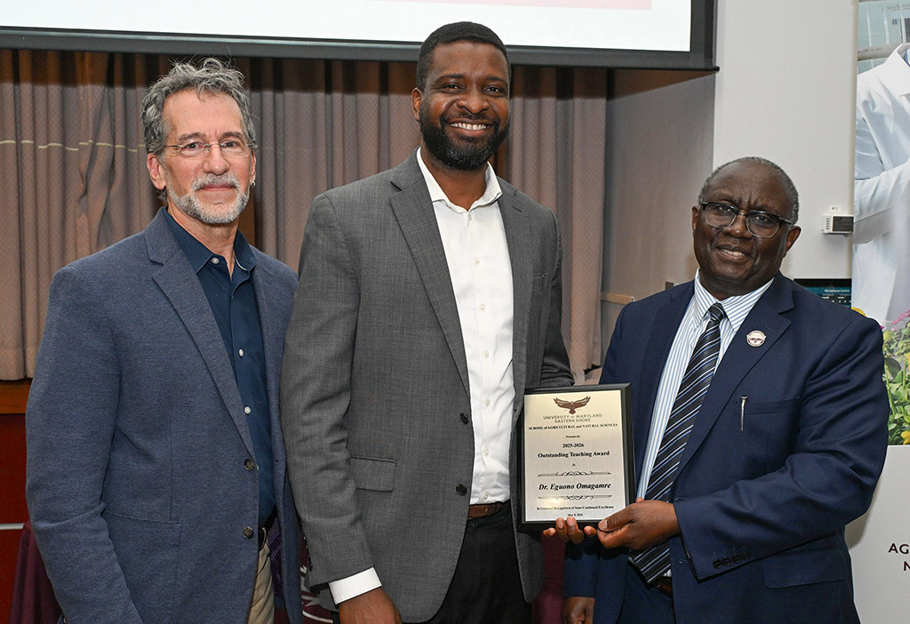 Department of Natural Sciences Outstanding Teaching Award winner Dr. Eguono Omagamre with Dean Dr. Moses T. Kairo and Chair Dr. Jonathan Cumming.