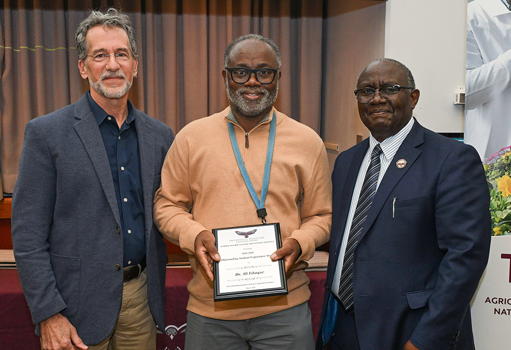 Department of Natural Sciences Outstanding Student Experience Award winner Dr. Ali Ishaque with Dean Dr. Moses T. Kairo and Chair Dr. Jonathan Cumming.