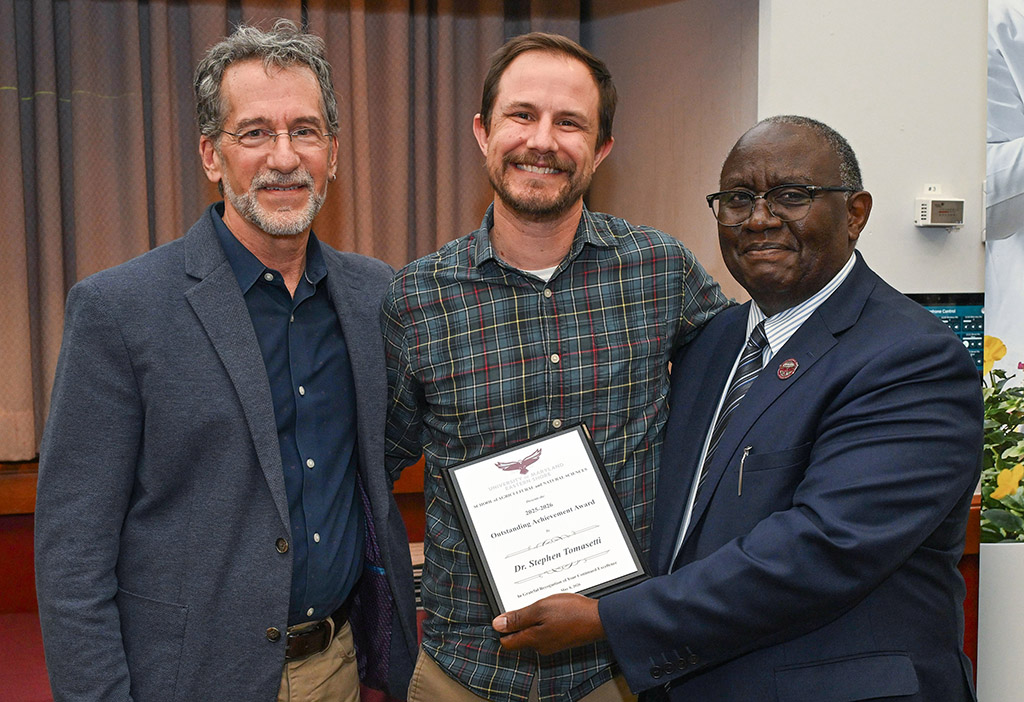 Department of Natural Sciences Outstanding Achievement Award winner Dr. Stephen Tomasetti with Dean Dr. Moses T. Kairo and Chair Dr. Jonathan Cumming.