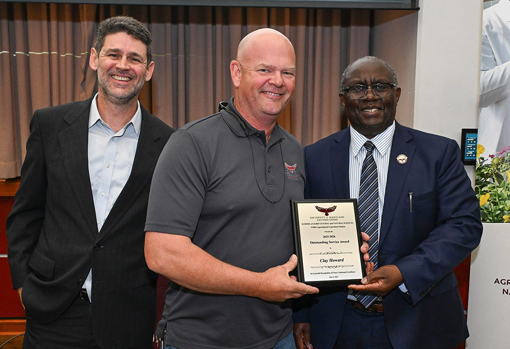 UMES Ag Experiment Station Outstanding Service Award winner Clay Howard with Dean Dr. Moses T. Kairo and Associate Dean Dr. Vagner Benedito.