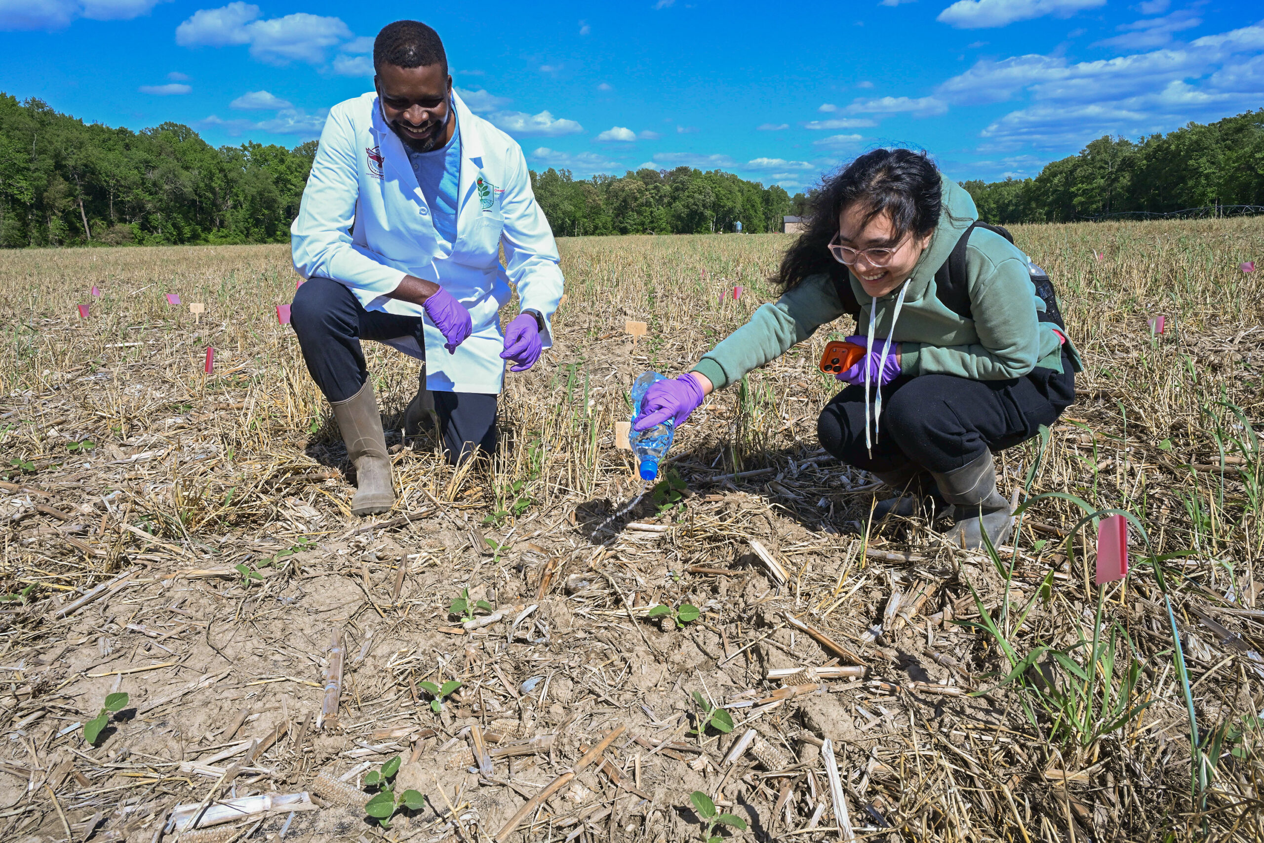 UMES researcher Wayne Omagamre and Sumantee Baidya, a graduate research assistant, are shown doing PFAS field work.