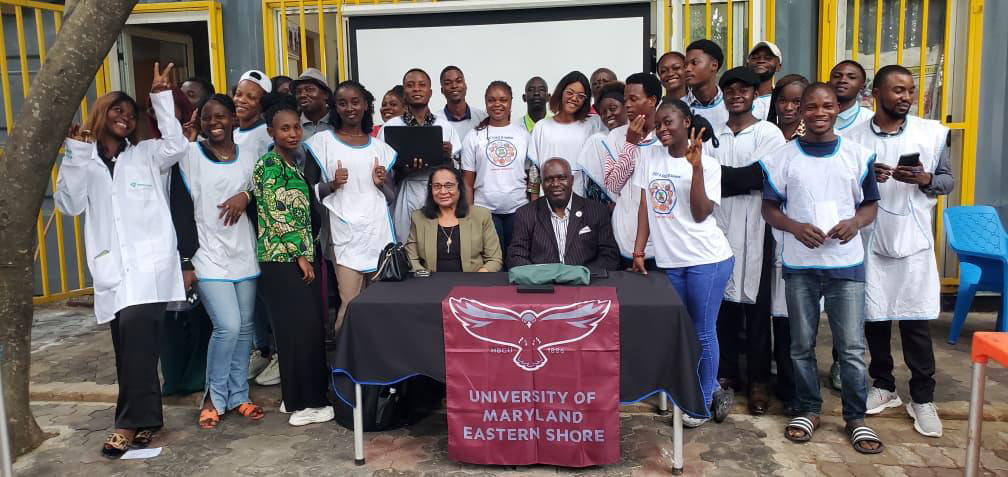 Dr. Salina Parveen, seated at left, and Dr. Stephan Tubene, seated at right, pose with trainees following the two-day food safety training program at the University of Kinshasa, DRC.