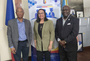 Drs. Stephan Tubene, right, and Salina Parveen, center, meet with the president of the University of Kinshasa, Professor Jean-Marie Kayembe Ntumba.