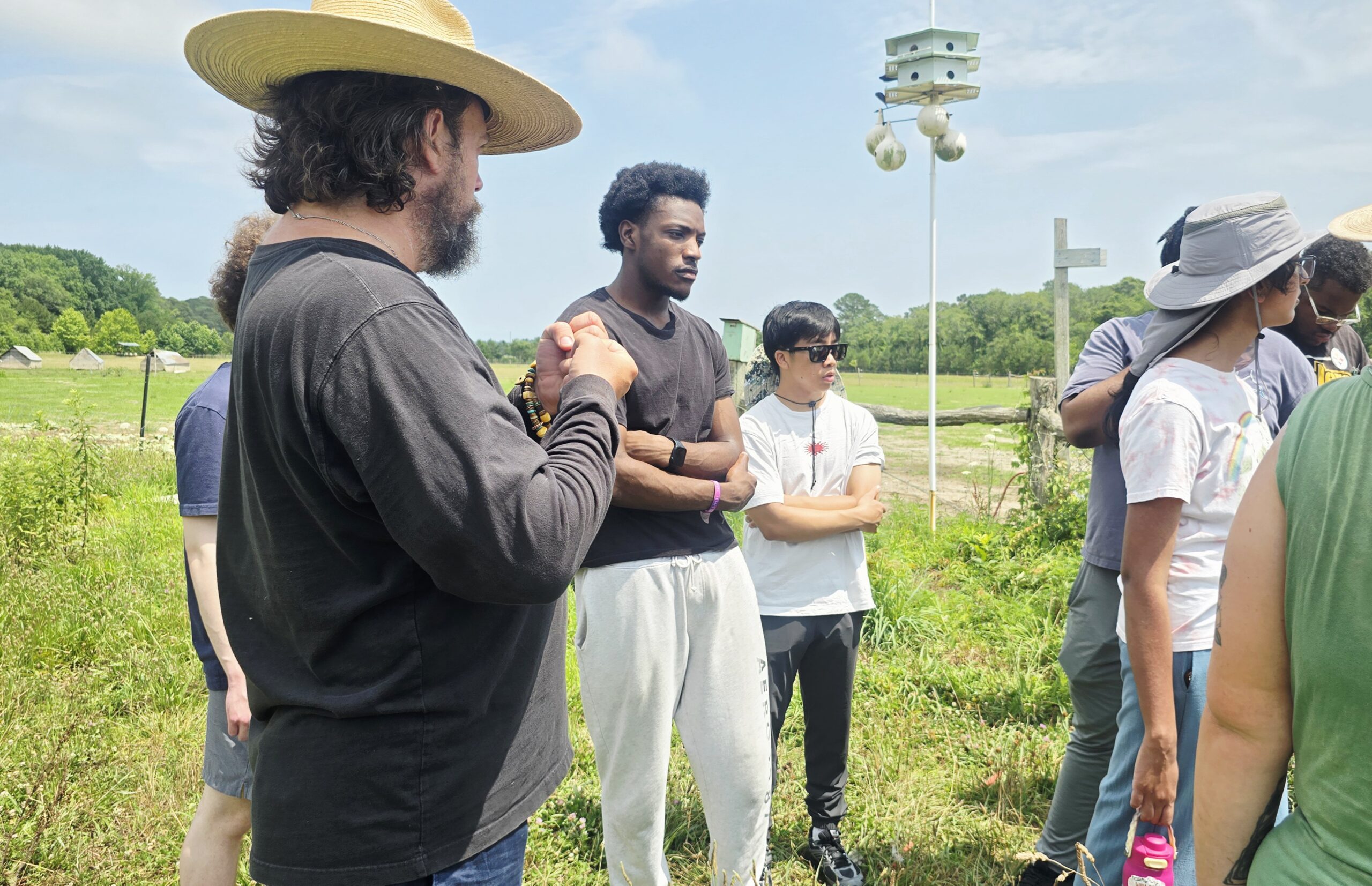 Stewart Lundy, co-owner of Perennial Roots Farm in Accomac, Virginia, talks to summer interns participating in UMES' Research and Extension Experiences for Undergraduates program funded by USDA NIFA.