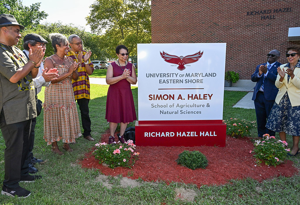 The Haley Family, from left, Bill Haley, Alan Haley, Anne Haley and Chris Haley, watch UMES President Heidi Anderson, left, pull the drape off the sign with the help of Moses Kairo, Dean of the School and Regent Yvette Lewis during the naming ceremony of the Simon A. Haley School of Agriculture & Natural Sciences on Tuesday, Sept. 8, 2026. (Photo by Todd Dudek, UMES Ag Communications)