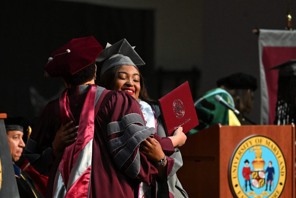 College graduate embraces college president